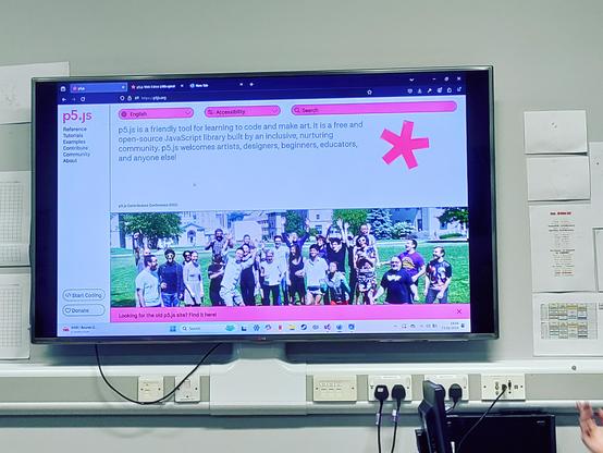 The first screen from the p5.js talk, showing a description of the p5 javascript library, along with a picture of a group of people standing on a lawn.