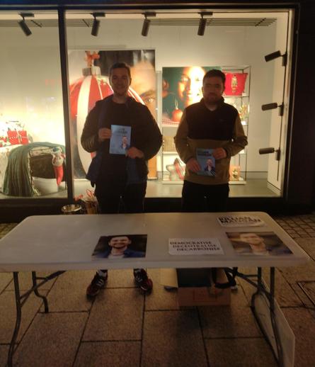 A photo of Killian and his cousin John at a stall in town outside Penney's.