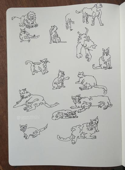 Black Fineliner on paper

Various sketches of cats, all drawn in one line.