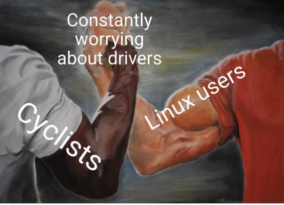 Two muscular arms clasping hands in solidarity. The arm on the left, labeled "Cyclists," wears a white sleeve. The arm on the right, labeled "Linux users," wears a red sleeve. The clasped hands are labeled "Constantly worrying about drivers."