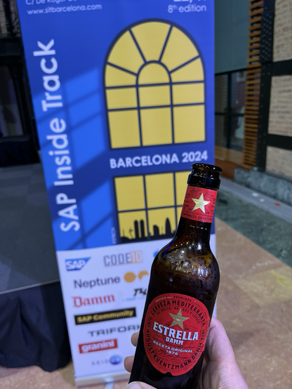 Bottle of beer in fron of #sitBCN