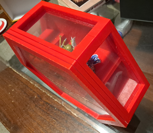 A view of the same display case above and to the side, showing two of the transparent windows in the upper sides of the hexagon.