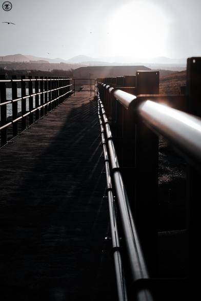 metal railings with sun reflecting off them
