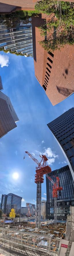 ベスト電器裏からの見晴らし。縦長パノラマ。MMTビル跡地とイムズ跡地の工事現場。