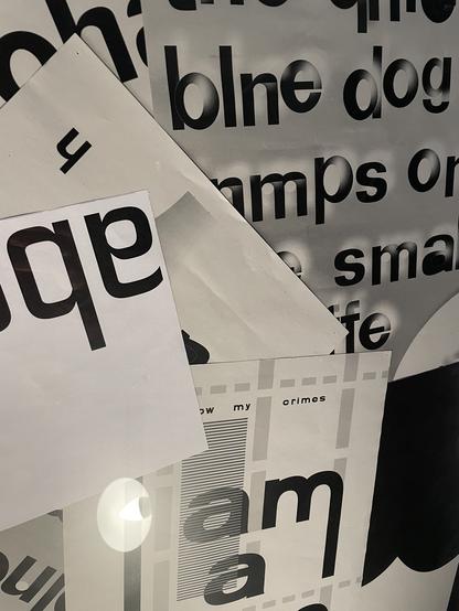a detail of a frame showing various posters with text in grunge optics
