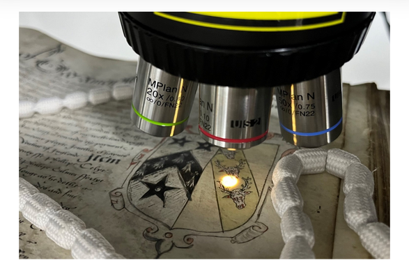 Head of Heritage Science Research, Marc Vermeulen using Raman spectroscopy to identify the pigment used in record PROB 11/61/557 at The National Archives. Credit: The National Archives