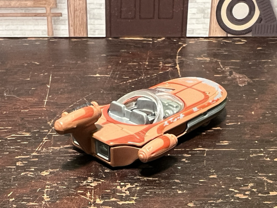 A HotWheels toy Landspeeder from Star Wars.