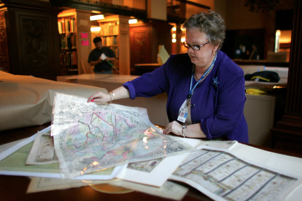 Alice Hudson in the map room of the New York Public Library in 2005. Credit: Chang W. Lee/The New York Times