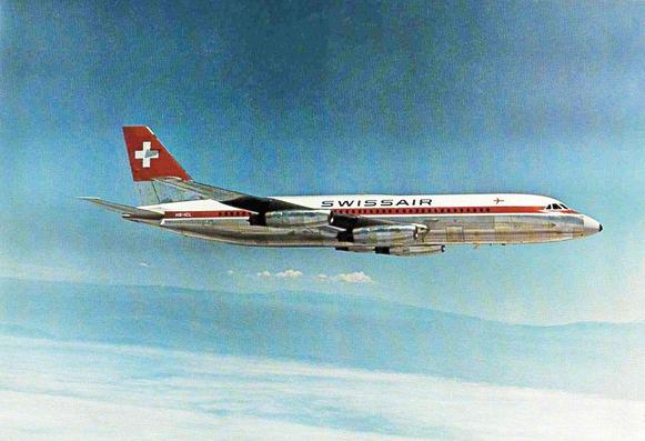 Plane is high in the sky flying left to right.