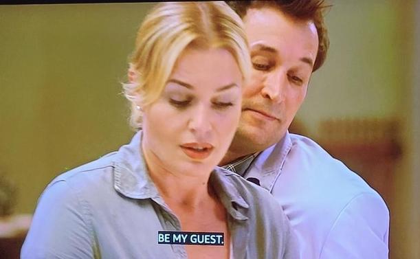 Rebecca Romijn and Noah Wylie in their respective Librarians' roles. He has just told her Be my guest so she's working on it but he can't help peeking around her shoulder to see the results.