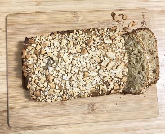 A loaf topped with cashews.