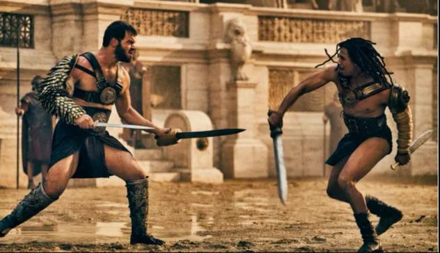 Poderosa imagen de dos gladiadores en plena lucha cuerpo a cuerpo con espadas en el Coliseo: el bárbaro germano y el africano Kwame.