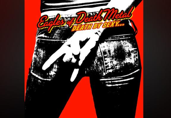 Cover of the band Eagles of death metal’s album “death by sexy“. Background and text is red. Someone in skinny jeans is holding their hand behind their back with the rock ‘n’ roll devil horn gesture.