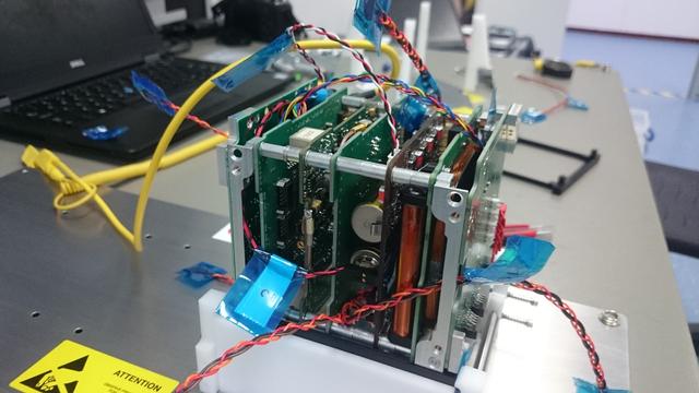 Stack of printed circuit boards in a CubeSat satellite frame