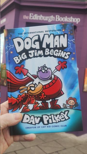 A copy of Dog Man - Big Jim Begins being held up outside the Edinburgh Bookshop