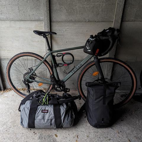 Picture of a bike with two large bags in front.