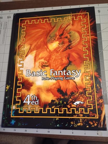 The cover of the new hardcover edition of the Basic Fantasy RPG, 4th edition.

A stylized image of a big, red fire breathing dragon.

The best cover so far of any Basic Fantasy product, though that's not a high bar to clear.