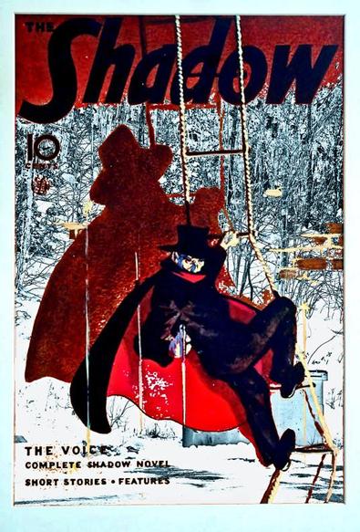 A modified cover of The Shadow Magazine, has a high contrast black and white photo as a background.  The are is covered in snow. Thin bare trees with snow are on the rise of a hill. In the foreground is snow on pavement and a metal dumpster bin.
The elements remaining from the cover are in colour, including the title of the magazine, a featured shadow novel, The Voice.
The figure of the Shadow is centred on the cover, as he hangs on a rope ladder, while shooting downwards. His large shadow in reddish brown floats against the background.