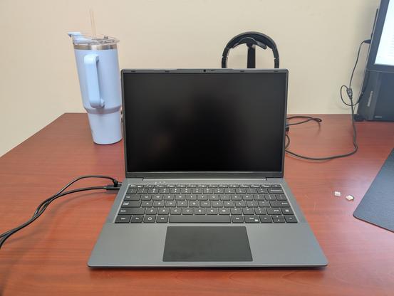 A lapdock sits on a work desk.