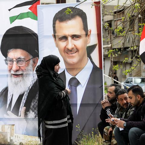 Images of President Bashar al-Assad of Syria, center, and Iran’s supreme leader, Ayatollah Ali Khamenei, south of Damascus, in March.