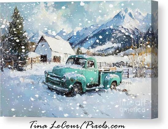 This is a pretty lwinter andscape of an old teal truck in front a rustic white barn with mountains in the background during a winter snowfall.