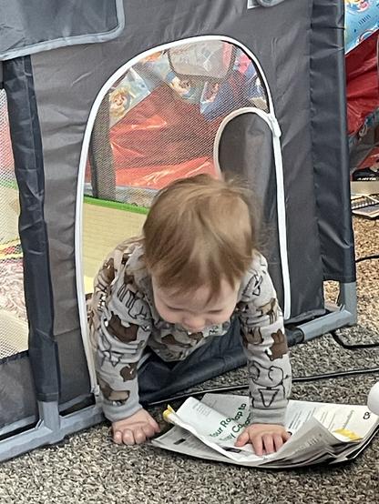 A toddler breaching the containment field because zippers are no longer a mystery.