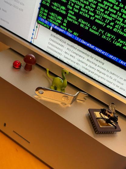 Apple II pack-in mini wrench sitting on a Mac Studio