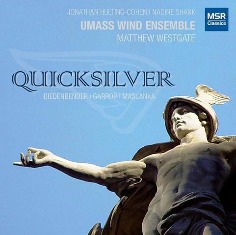 Cover of UMass Wind Ensemble’s MSR Classics album “Quicksilver - Music for Saxophone, Piano and Wind Ensemble”, featuring a statue of a God (Mercury, winged head?) with outstretched arm, and the blue sky as background.