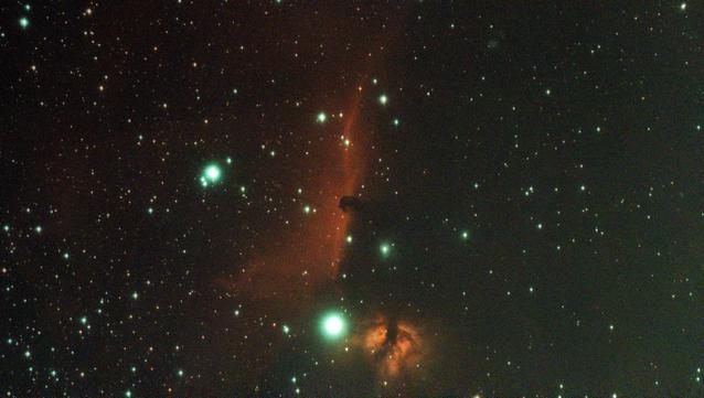 The Horsehead Nebula, lots of red hydrogen, and some larger greenish blue stars.