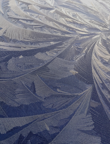 Facets of frozen feathery shards.