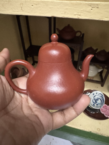 This is probably my very best pot. It rings like a bell used for puerh green and well aged. It’s red and rather shiny with a high dome