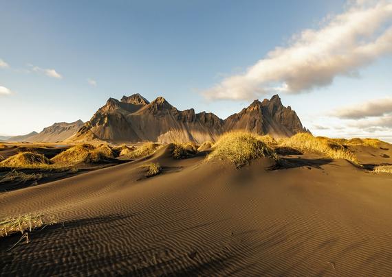 Untouched sand ripples in the dunes at Stokksnes with Vestrahorn touched by the setting sun. I love the shadows of the grasses and dunes and the golden light of the sun setting.