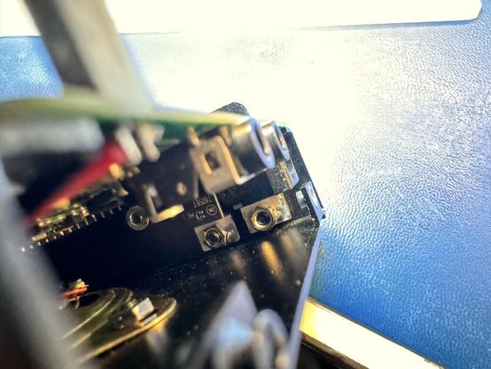 The voltage regulators installed in the radio enclosure. Showing that it is a very tight space making the installation of the screw nuts difficult.