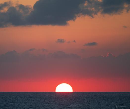 A dramatic sunset over the sea.