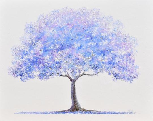 A Jacaranda tree with vibrant shades of blue and purple stands prominently against a light background. The leaves of the Jacaranda create a soft, dreamlike effect, enhancing the serene and peaceful atmosphere.