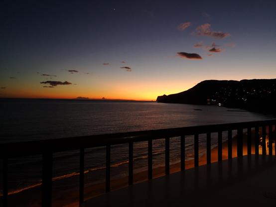 Photograph taken off a balcony  showing the final fling of a lovely sunset.