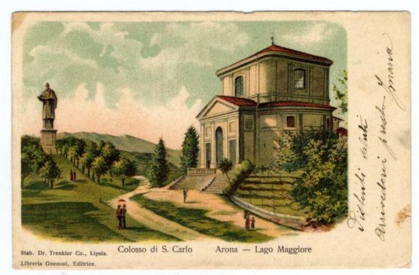 The image depicts a vintage postcard featuring an illustration of the Colosso di S. Carlo, also known as St. Charles' Column, located near Arona on Lake Maggiore in Italy. The artwork shows a classical-style structure with columns and triangular pediments, situated amidst lush greenery with trees and shrubs surrounding it. A statue stands prominently to the left of the building, possibly representing Saint Charles or another significant figure.
In front of the Colosso di S. Carlo is a path leading up to its steps, where people are seen walking; one person appears to be holding an umbrella over two individuals on the pathway. The overall scene suggests a peaceful and picturesque setting typical for postcards from that era, capturing both architectural beauty and natural surroundings.
The card's borders include handwritten notes in cursive script, likely indicating personal messages or ownership details added by previous users of this postcard. There is also printed text at the bottom providing location information: "Colosso di S. Carlo" with Arona - Lago Maggiore. Additional credits are given to Stab. Dr. Trentkler Co., Lipsia, and Libreria Gremmli's Editrice for their contributions in creating this postcard.