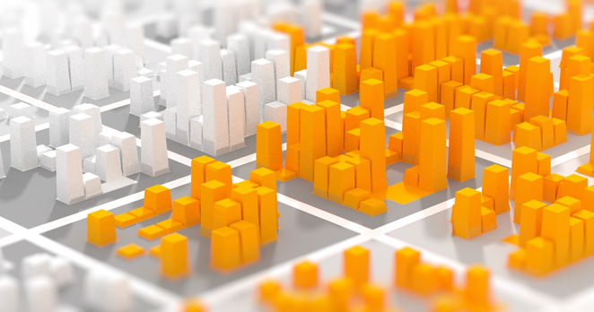 A model city made of cuboids. The city is segregated by color, with bright orange cuboids/buildings on one side, and white ones on the opposite side.