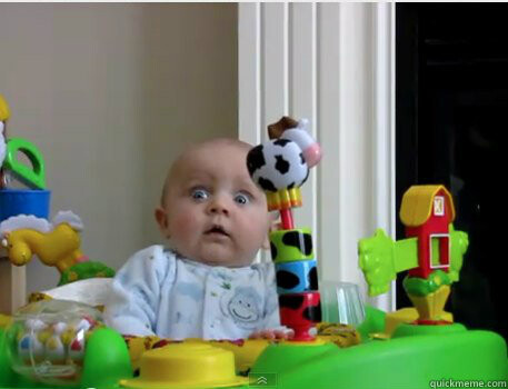 A picture of a baby, surrounded by plastic toys, looking scared. It's been used in memes.