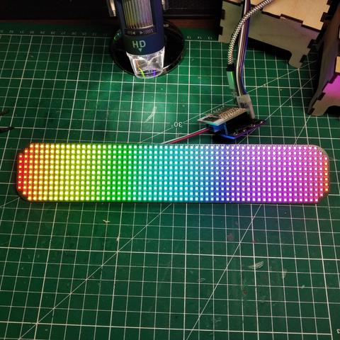 A 11x60 led matrix (with 3 leds missing in each corners).
The 648 leds are displaying all the colors (possible with leds) :)