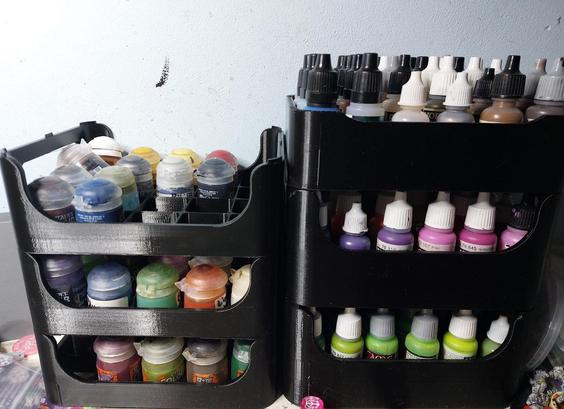 2 stacks of 3 paint trays each, the left one missing handles
