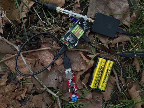 This image shows my portable spectrum capture recorder based on a Pi Zero 2W that I have mentioned in my previous posts. It is connected to an AirSpy HF+ Discovery, which is in turn connected to a 2x6m dipole mounted over a big tree. It is externally powered by two 18650 LiIon batteries and a 5V step down converter.