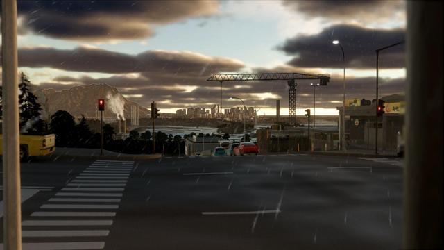 The view from a crossing in an industrial area. In the center the road goes downward and far away in the background, the skyline of a city business distrct with high raises.