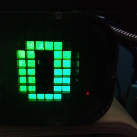 Close of the matrix. A zero (0) is displayed in green. 
There is some light coming from cells that are not supposed to be lit.