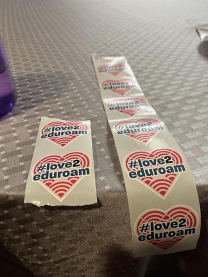 #love2eduroam stickers on a table