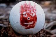 A white volleyball with a red face painted on the side. AKA Wilson from the movie CastAway
