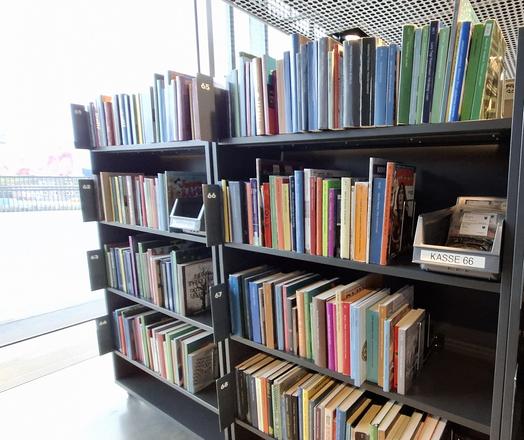 A section of shelves at my local library (Aarhus, Denmark) filled with rows of reservations, including inter-library loans - mostly books but also some CDS and DVDS