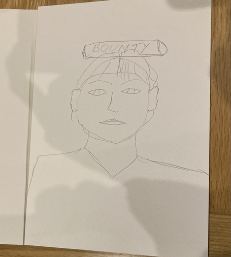 Pencil sketch of person with a chocolate bounty bar on their head.