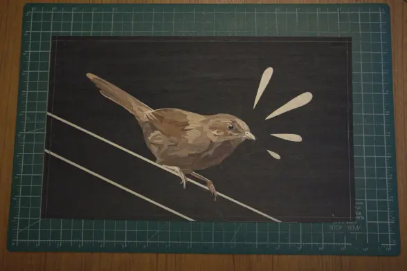 work in progress marquetry image of a bird