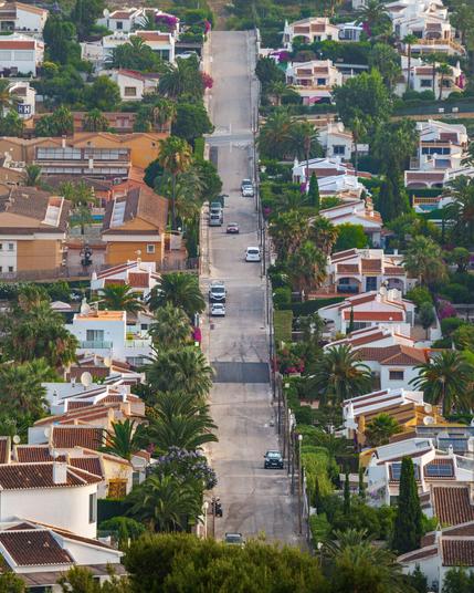 Spanish street stretching away from high ground far away